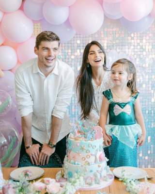Penelope celebrating her birthday with her mom and her mom's boyfriend. 